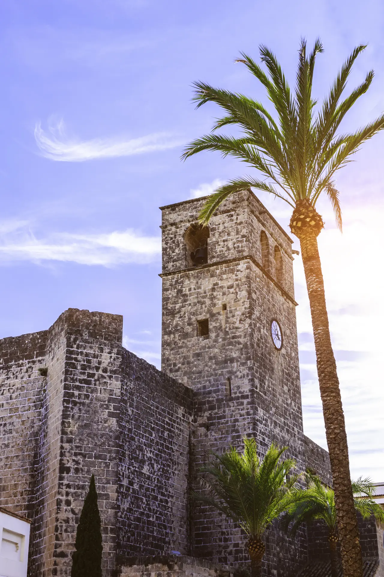 The bell tower of the church of San Bartolomé in the old town of Jávea