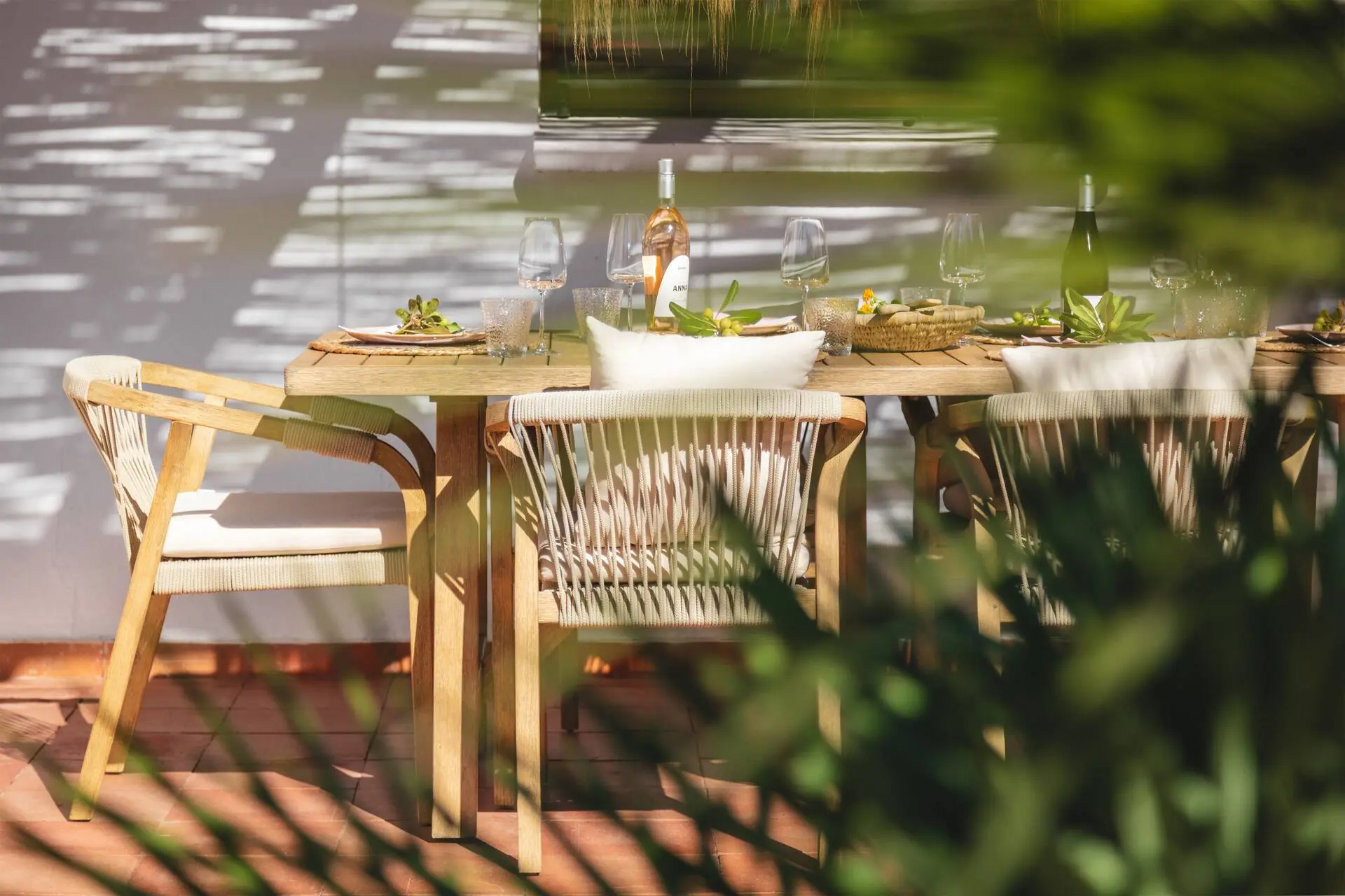 Table laid under the pergola in the garden