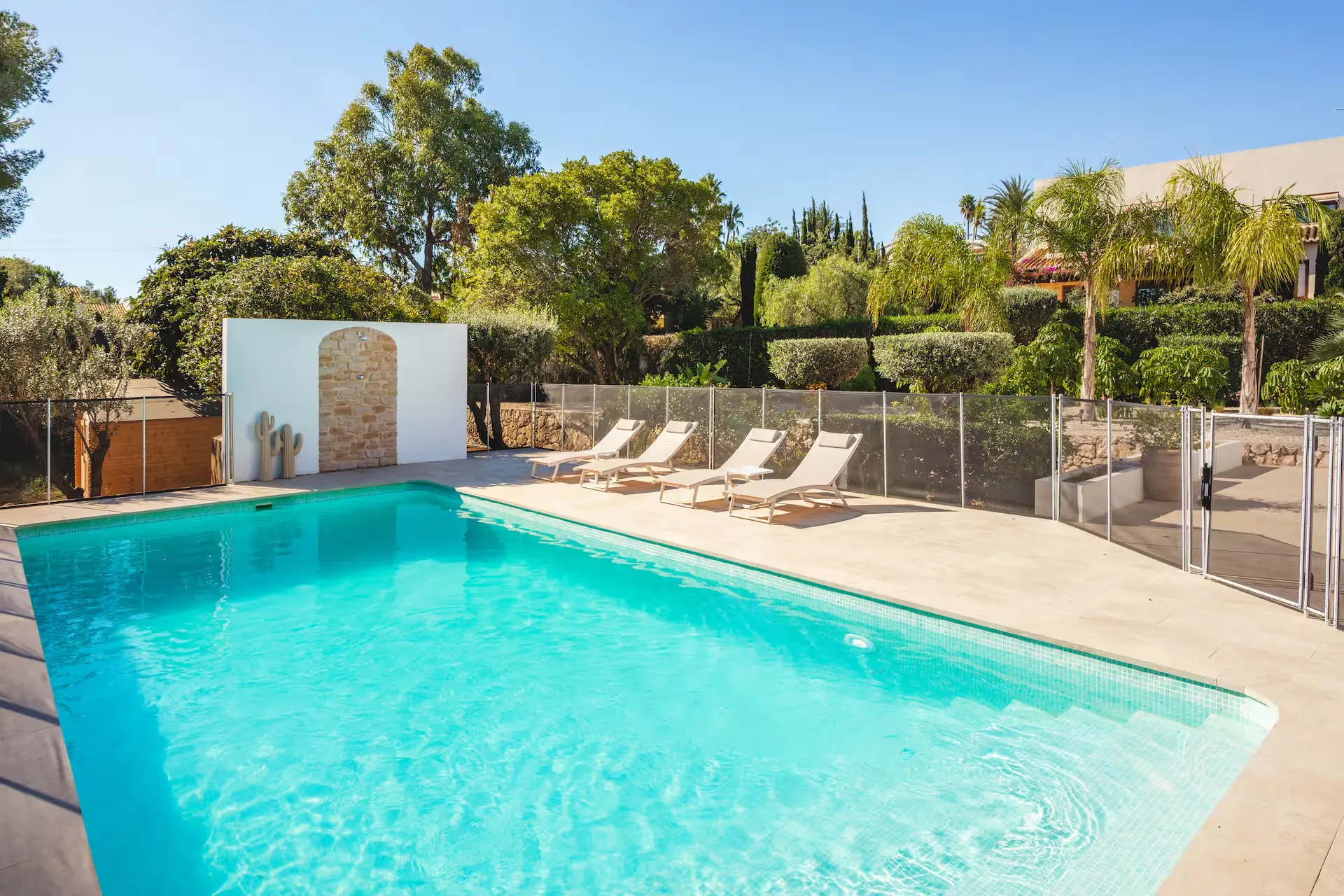 Sun loungers on the terrace beside the pool